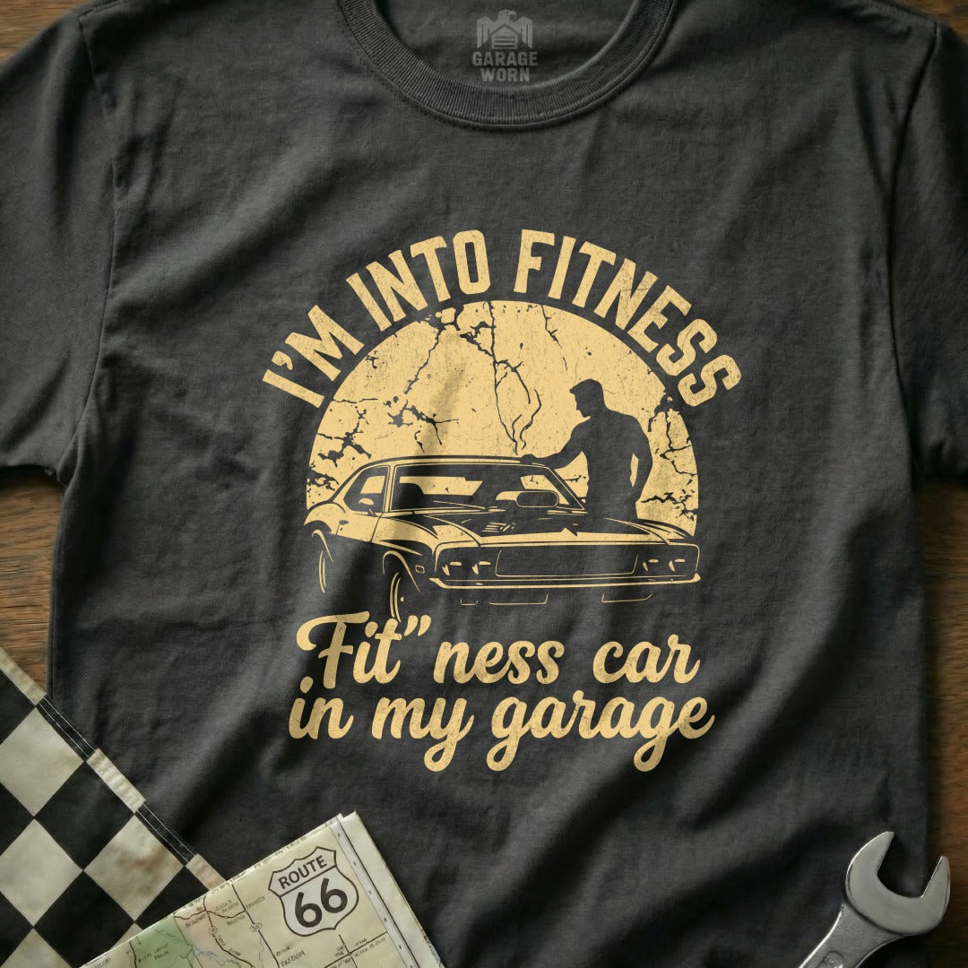 T-shirt with "I'm Into Fitness Fit-ness car in my garage" text and car graphic.