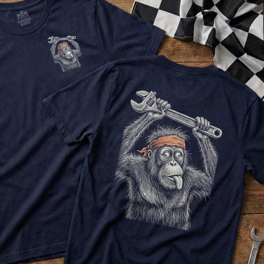 Dark blue t-shirt with an orangutan holding a wrench and sticking its tongue out.