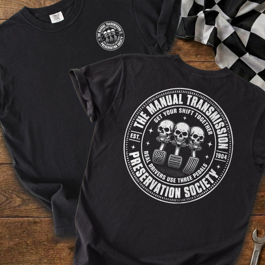 Black t-shirt with "The Manual Transmission Preservation Society" graphic featuring skulls and pedals.