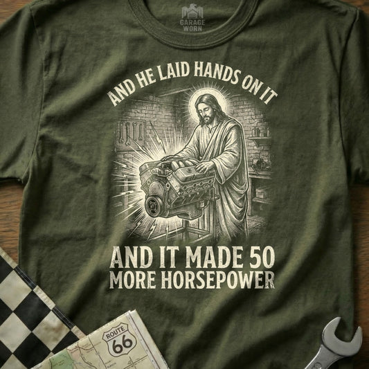 Jesus working on an engine, with text "And he laid hands on it and it made 50 more horsepower".
