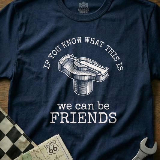 Navy t-shirt with distributor cap graphic and "we can be friends" text.