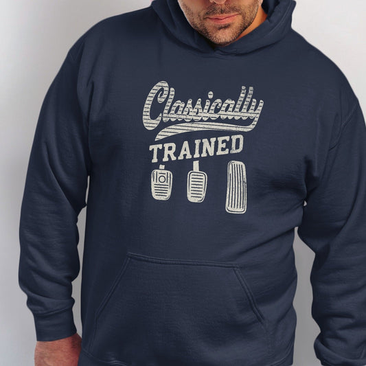 Navy hoodie with "Classically TRAINED" text and three car pedals graphic.