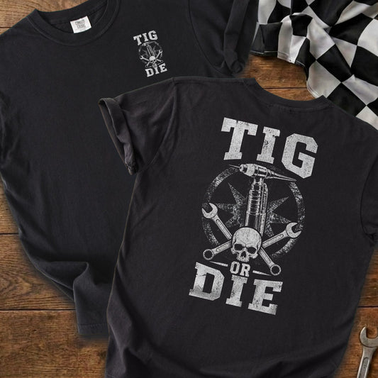 TIG welding graphic with skull, wrenches, and text "TIG OR DIE" on a black t-shirt.