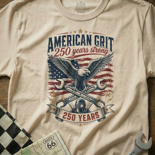 T-shirt graphic with eagle, wrenches, American flag, and text "American Grit 250 Years Strong."