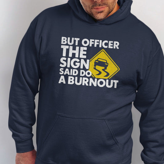 Navy hoodie with text "But Officer The Sign Said Do A Burnout" and a slippery road sign.