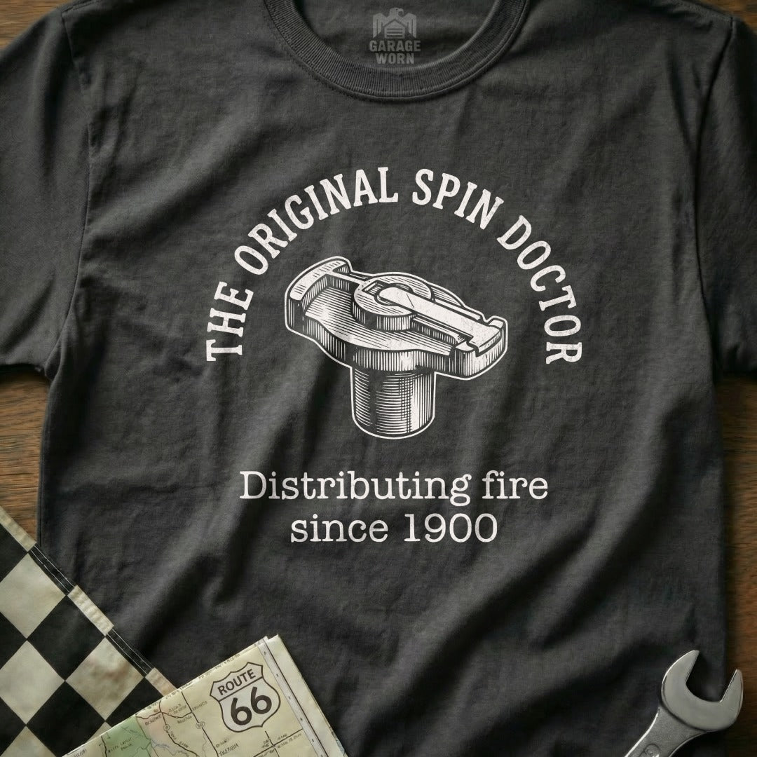 Dark t-shirt with "The Original Spin Doctor" and "Distributing fire since 1900".