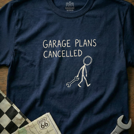 Navy t-shirt with "GARAGE PLANS CANCELLED" and a stick figure holding a wrench.