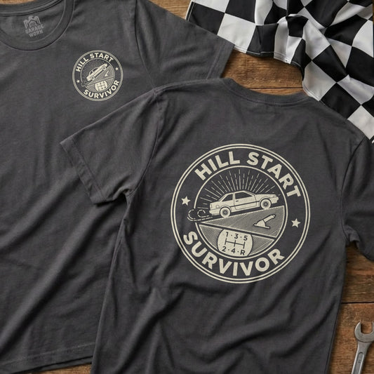 Dark grey t-shirt with "Hill Start Survivor" text and truck graphic.