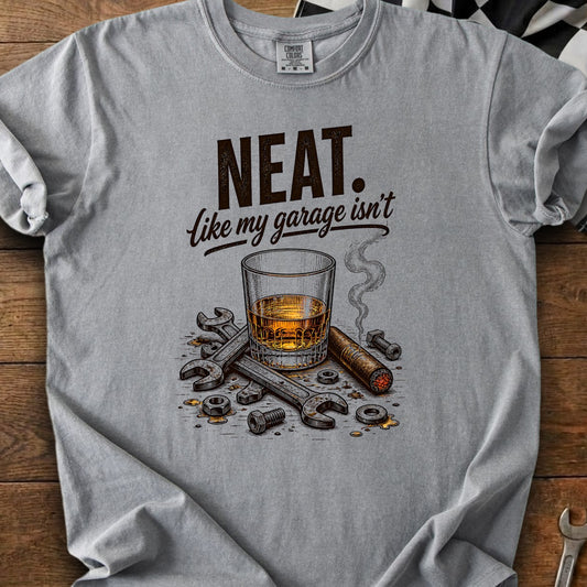 "NEAT. Like my garage isn't" text graphic with whiskey, cigar, and tools.