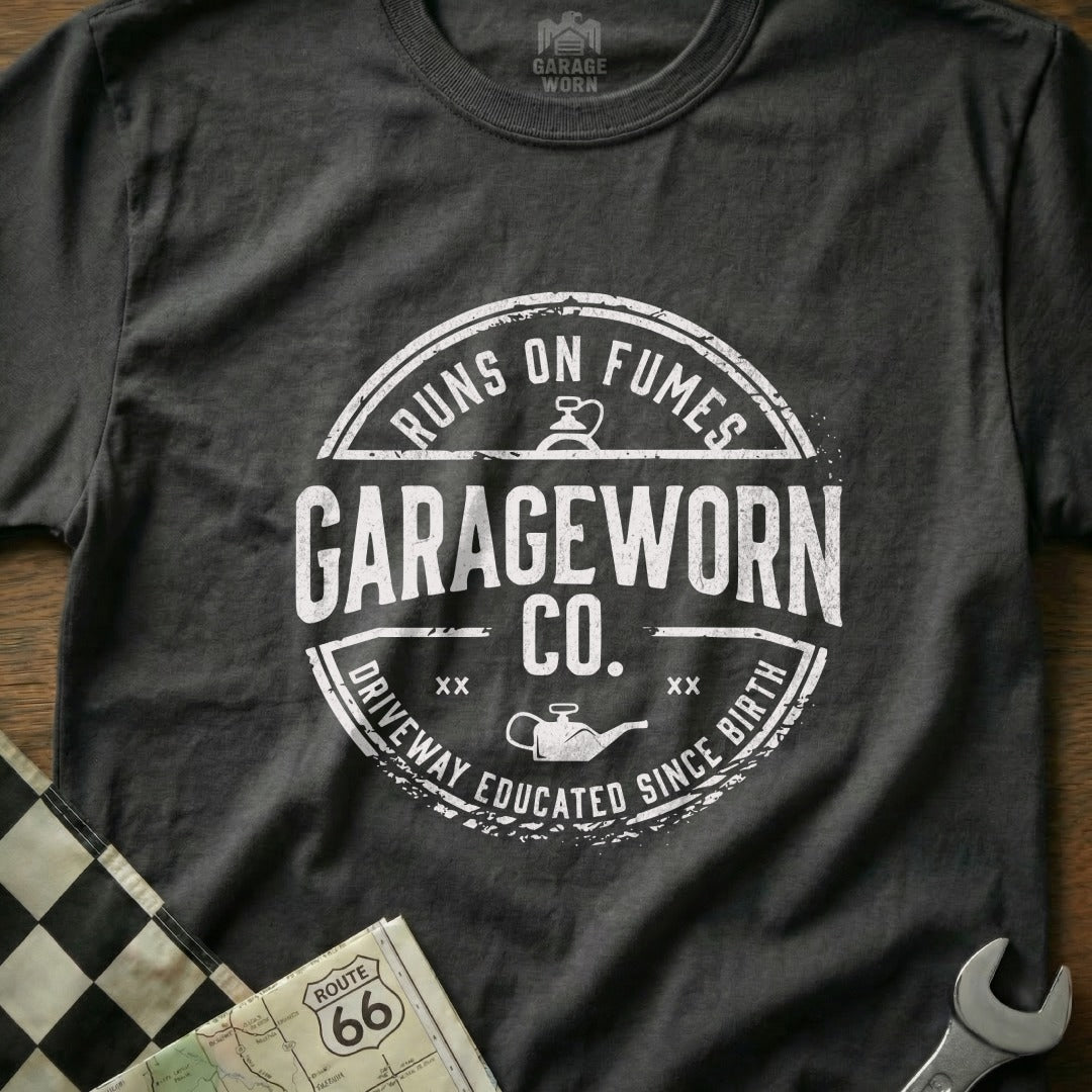 GarageWorn Co. t-shirt with "Runs on Fumes" and "Driveway Educated Since Birth" text.