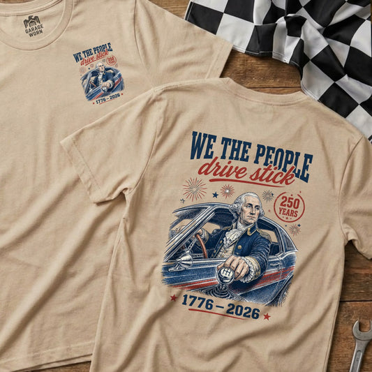 George Washington in a car, "We the People drive stick" graphic, 1776-2026.