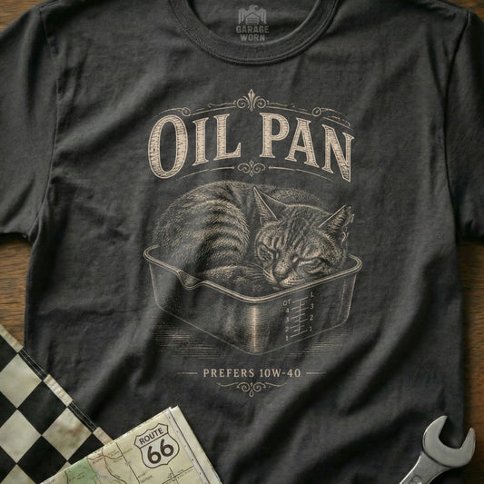 Black t-shirt graphic of a sleeping cat in an oil pan, "OIL PAN" above, "PREFERS 10W-40" below.