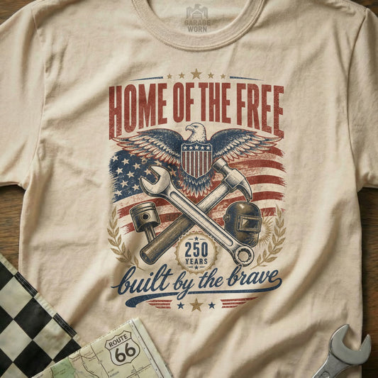 Cream t-shirt with "Home of the Free," eagle, American flag, 250 years, and "built by the brave."
