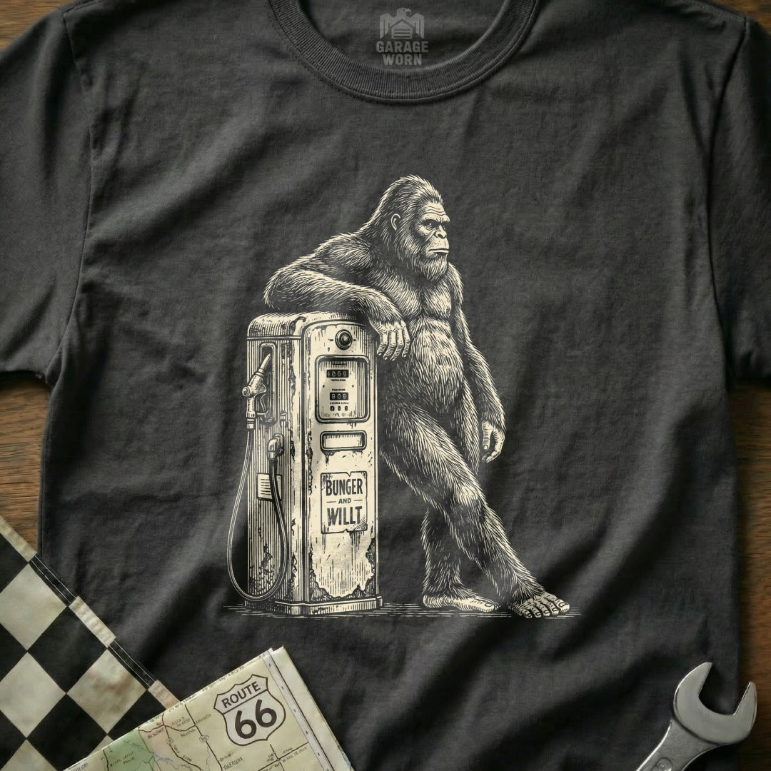 Graphic tee with Bigfoot leaning on an old-fashioned gas pump.
