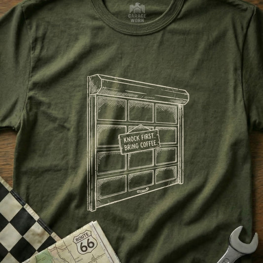 Garage door graphic with "KNOCK FIRST, BRING COFFEE" sign on t-shirt.
