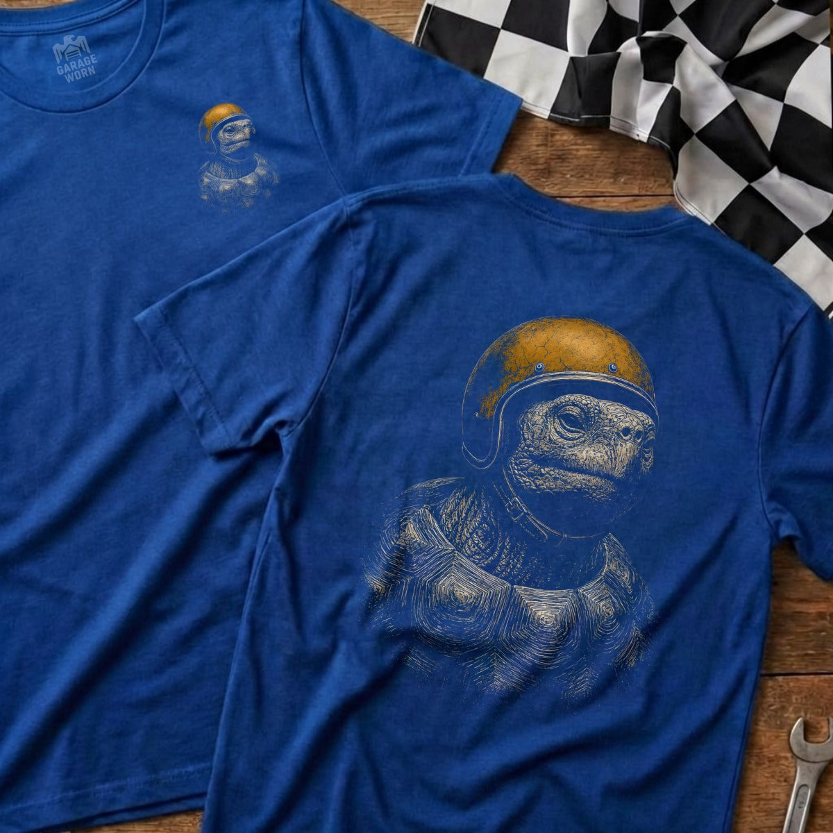 Blue t-shirt with a tortoise wearing a yellow helmet and a checkered flag.