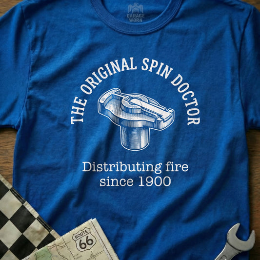 Blue t-shirt with "The Original Spin Doctor Distributing Fire since 1900" text and distributor cap graphic.