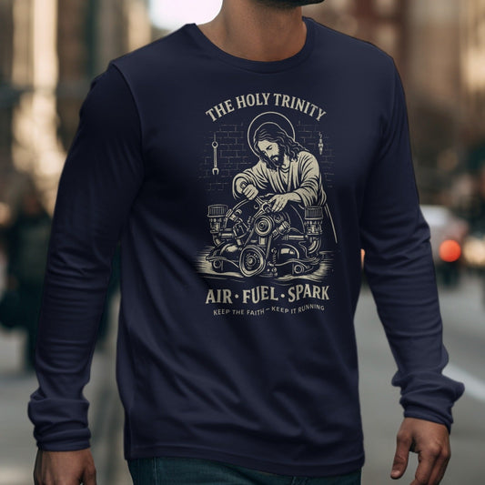 Navy long-sleeve shirt with Jesus working on an engine design; "The Holy Trinity," "Air. Fuel. Spark."