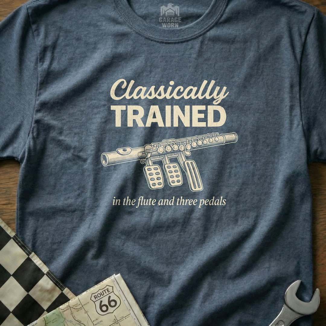 Blue t-shirt with "Classically Trained in the flute and three pedals" text.