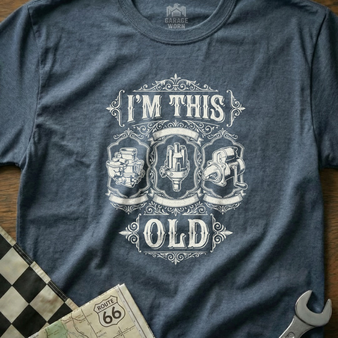 T-shirt with "I'm This Old" text and vintage engine parts illustration.