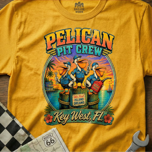 Yellow t-shirt with "Pelican Pit Crew" graphic featuring pelicans with tools and gas can.