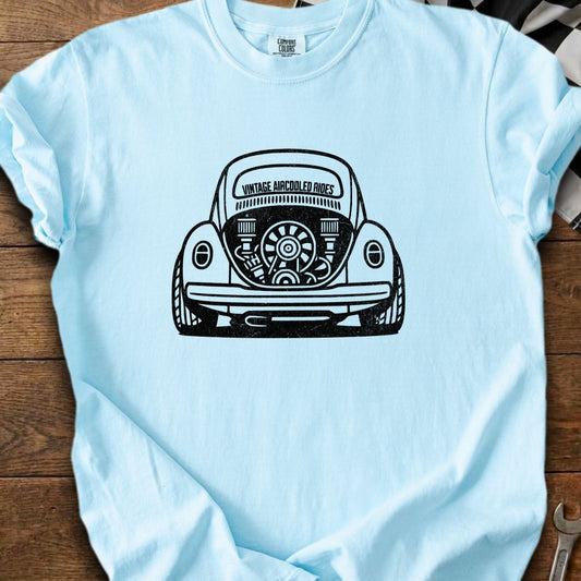 Light blue t-shirt with black vintage Volkswagen Beetle engine graphic and text.