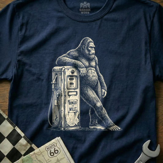 Bigfoot leaning on a vintage gas pump with "BUNKER AND WILLT" text.