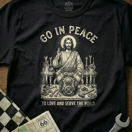 Jesus with tools and car engine, "Go in Peace to Love and Serve the Build."