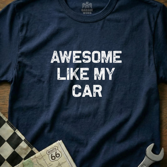 Navy t-shirt with "AWESOME LIKE MY CAR" in white text, beside checkered flag.