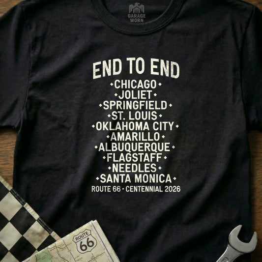 Black t-shirt with white text listing Route 66 cities and "CENTENNIAL 2026".
