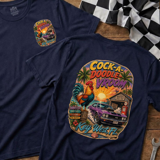 Navy shirt with "Cock-A-Doodle Vroom" graphic featuring a rooster, car, and tropical scene.