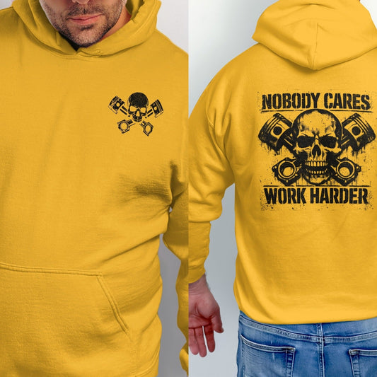 Yellow hoodie with skull, pistons, and text "Nobody Cares Work Harder".