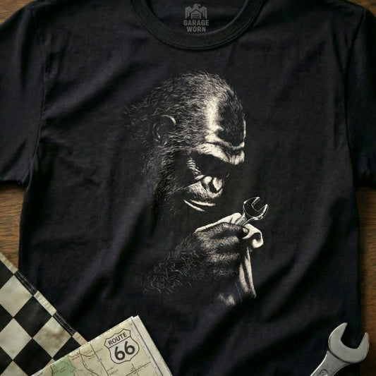 Black t-shirt with chimpanzee holding a wrench and a Route 66 map.