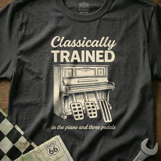 T-shirt with illustration of a vintage piano and pedals, text "CLASSICALLY TRAINED".