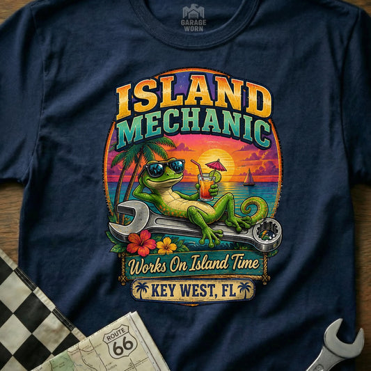 T-shirt graphic: lizard with sunglasses on a wrench at sunset with "Island Mechanic Works On Island Time Key West, FL" text.