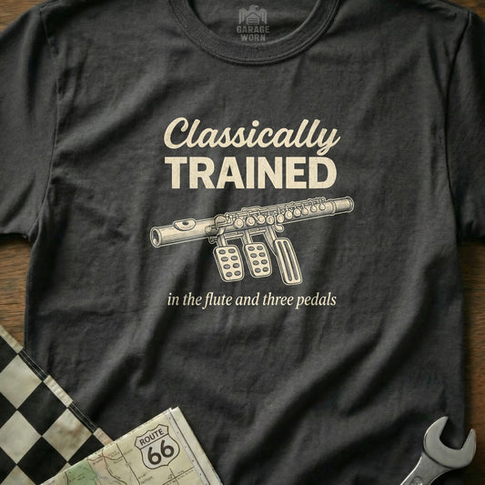 Dark grey t-shirt with "Classically Trained in the flute and three pedals" text and a flute illustration.