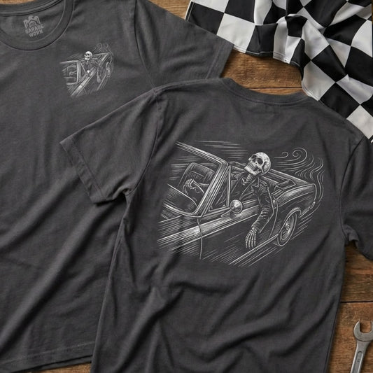 Dark gray t-shirt with illustration of skeleton driving a vintage car.