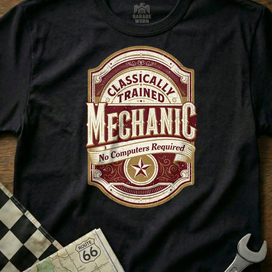 Mechanic badge on a black t-shirt: "Classically Trained Mechanic - No Computers Required".