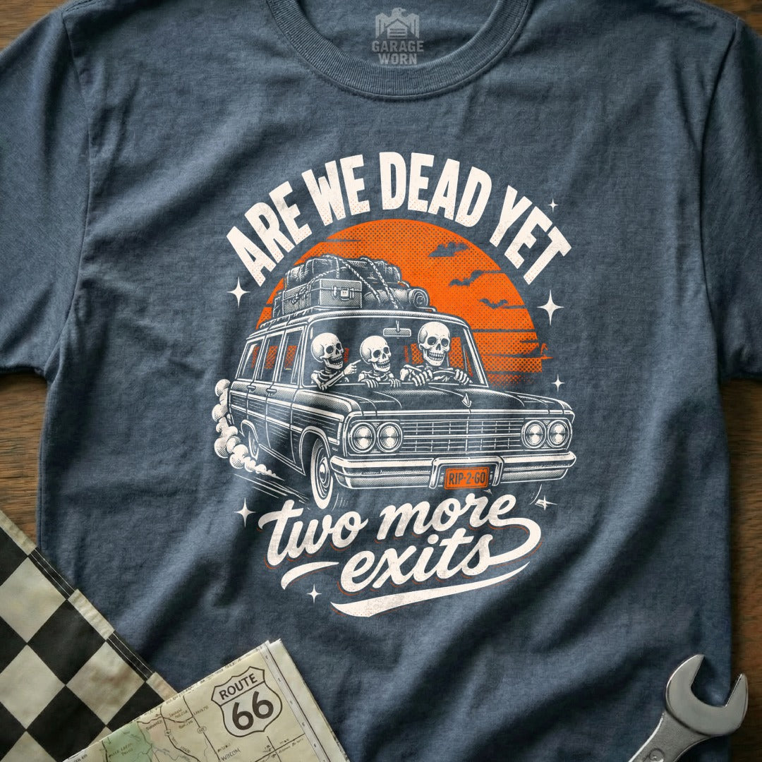 Skeleton road trip in a station wagon with "ARE WE DEAD YET two more exits" text.
