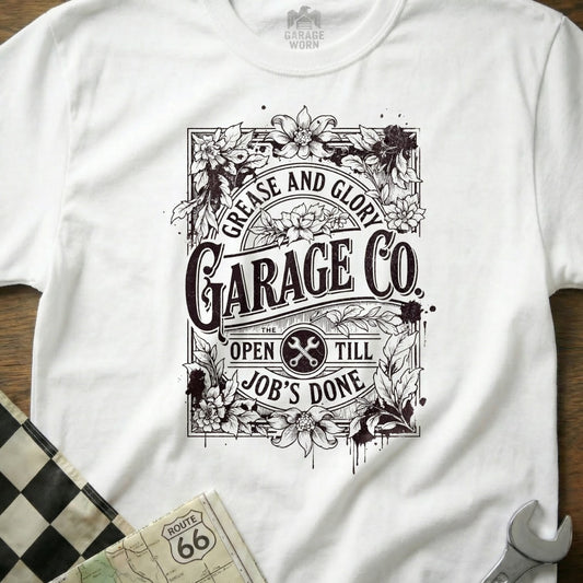 White t-shirt with "Grease and Glory Garage Co." logo and floral design.