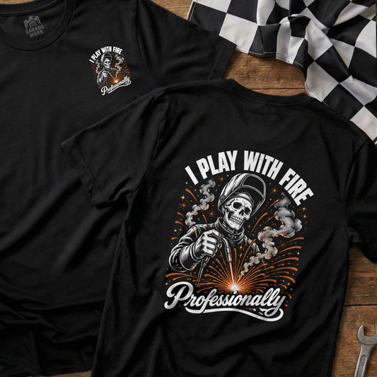 Black t-shirt with welding skeleton graphic and text "I Play With Fire Professionally".