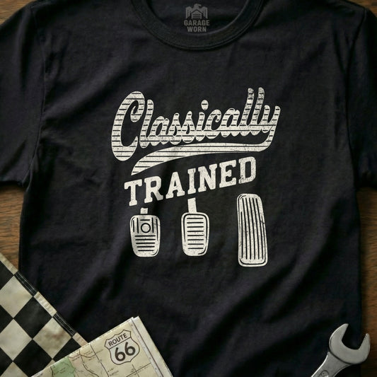 Black t-shirt with "Classically Trained" and three pedals.