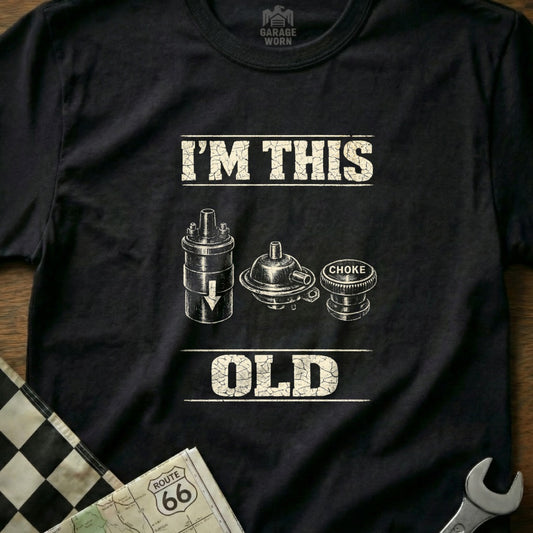 T-shirt with "I'M THIS OLD" and vintage automotive parts.