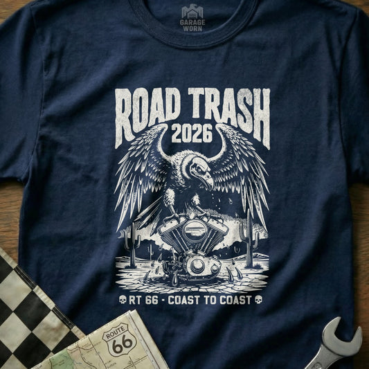 Navy t-shirt featuring a distressed vulture over a motorcycle engine, "Road Trash 2026" and Route 66 graphics.