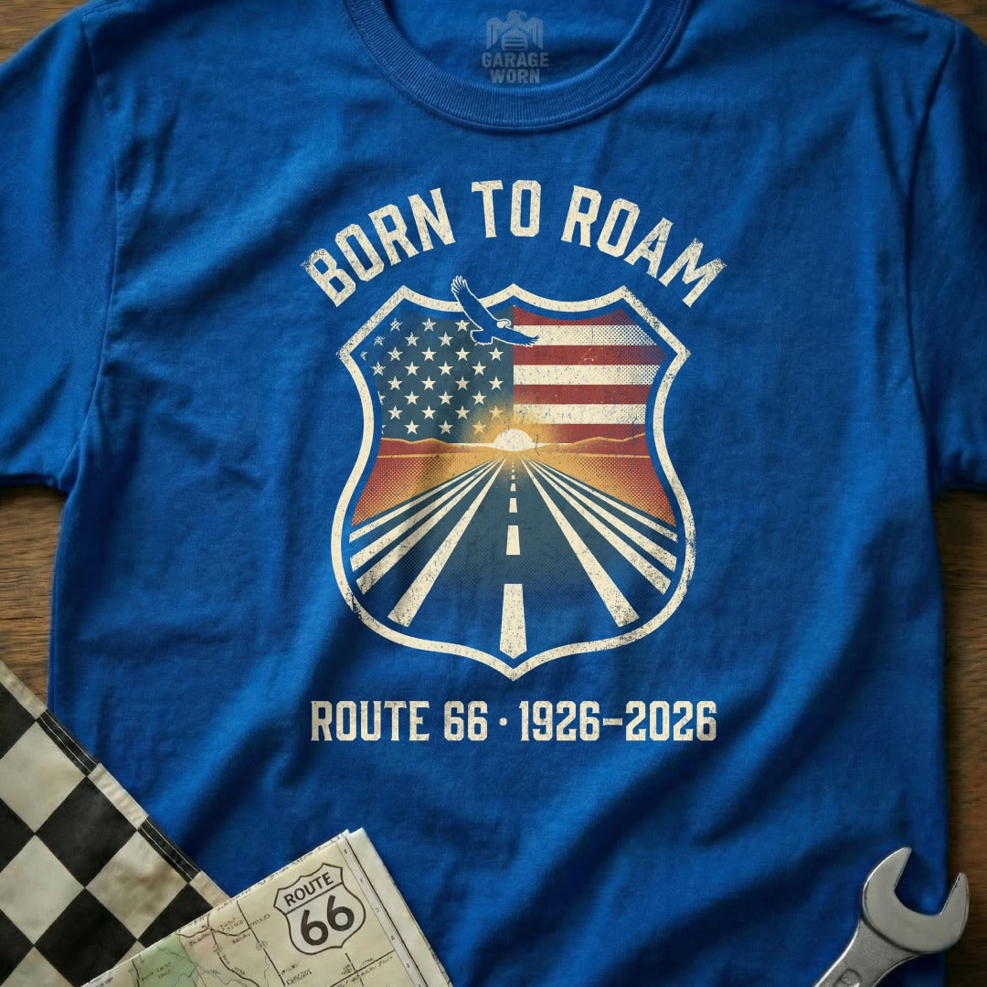 Blue t-shirt with "Born to Roam Route 66 1926-2026" shield graphic.