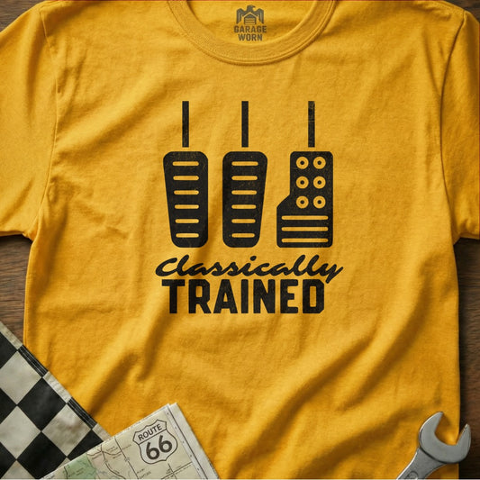 Yellow t-shirt with three black pedals and "Classically TRAINED" text.