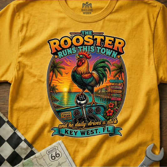 Yellow t-shirt with a rooster, gear shift, and Key West scene. "The Rooster Runs This Town" and "Key West, FL" text.