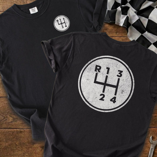 Black t-shirts with a distressed manual transmission shift pattern design.