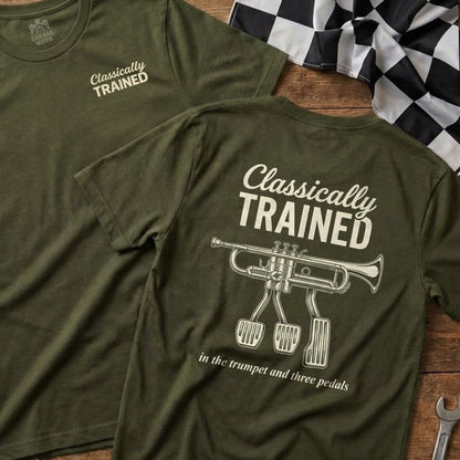 Olive green t-shirt with "Classically Trained" and trumpet/pedal graphic.