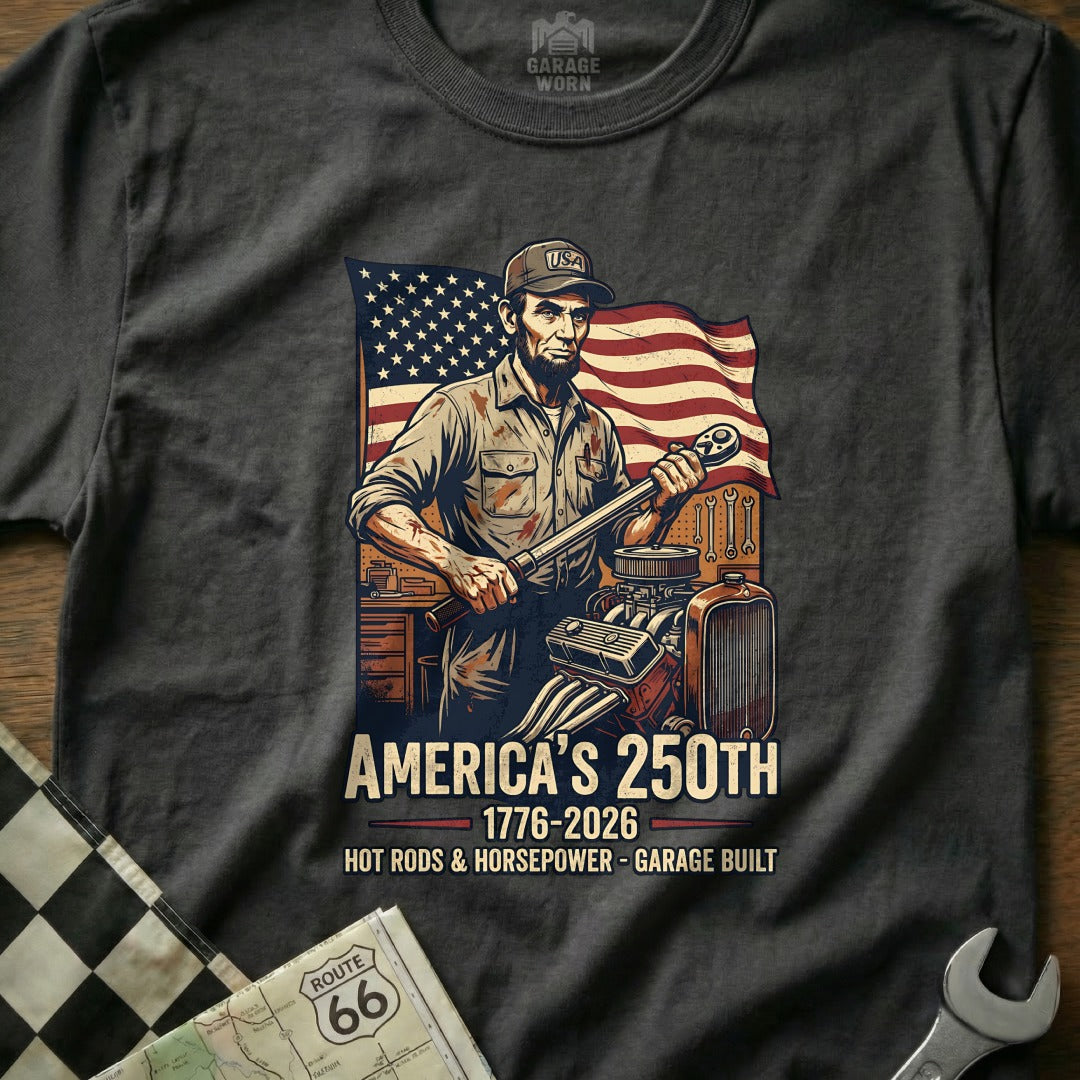 Abraham Lincoln holding wrench with American flag and car engine, "America's 250th" text.